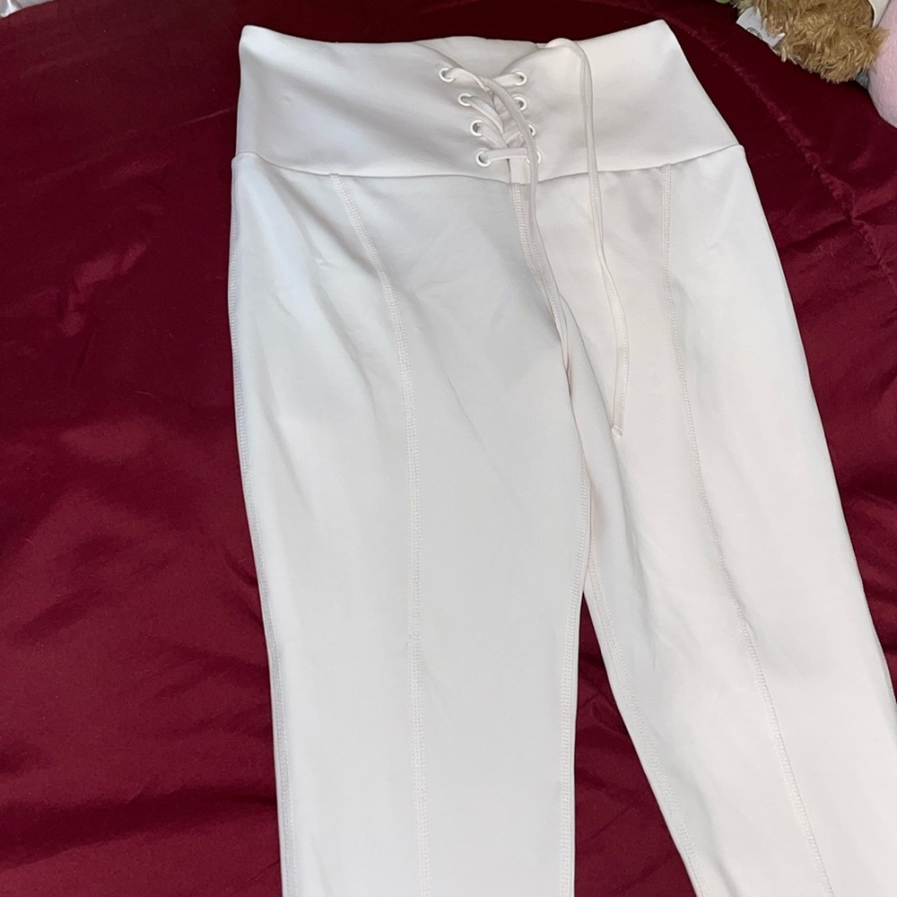 I am selling these nude pink Guess leggings